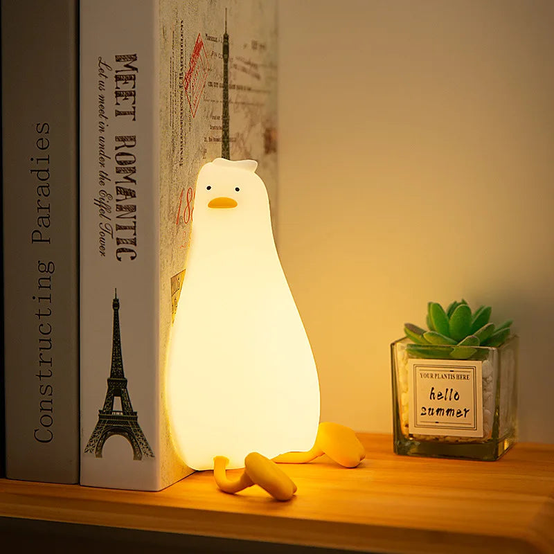 OuXean Fun Lying Duck Turning Duck Silicone Night Light Creative LED USB Table Light Charging Fun Mobile Phone Bracket