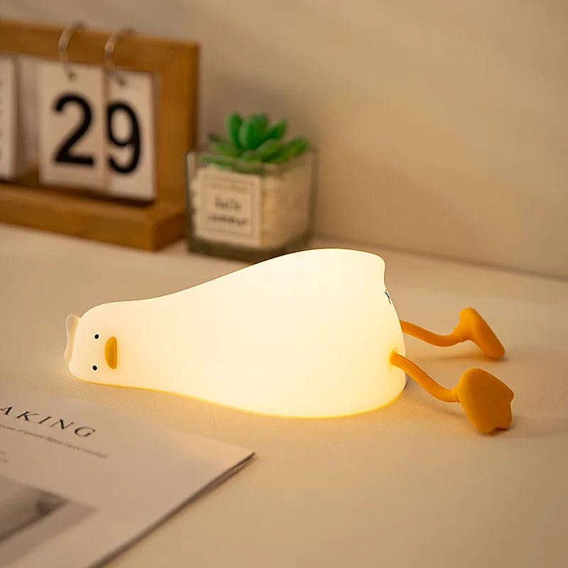 OuXean Fun Lying Duck Turning Duck Silicone Night Light Creative LED USB Table Light Charging Fun Mobile Phone Bracket