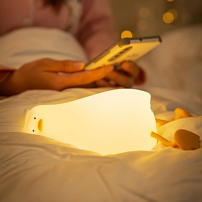 OuXean Fun Lying Duck Turning Duck Silicone Night Light Creative LED USB Table Light Charging Fun Mobile Phone Bracket